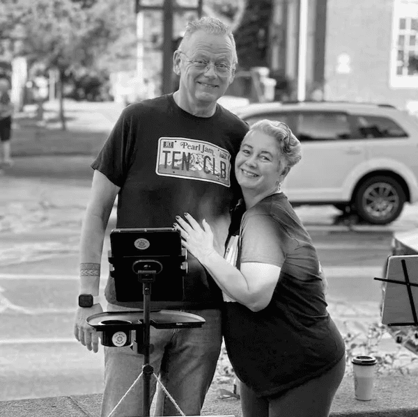 Lela and Dennis Whalen smiling together outdoors